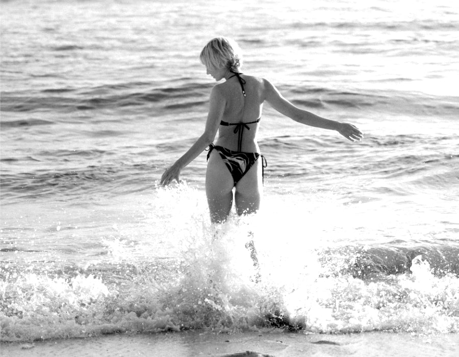 woman enjoying the waves in the best women's bikini by Koraru sustainable swimwear