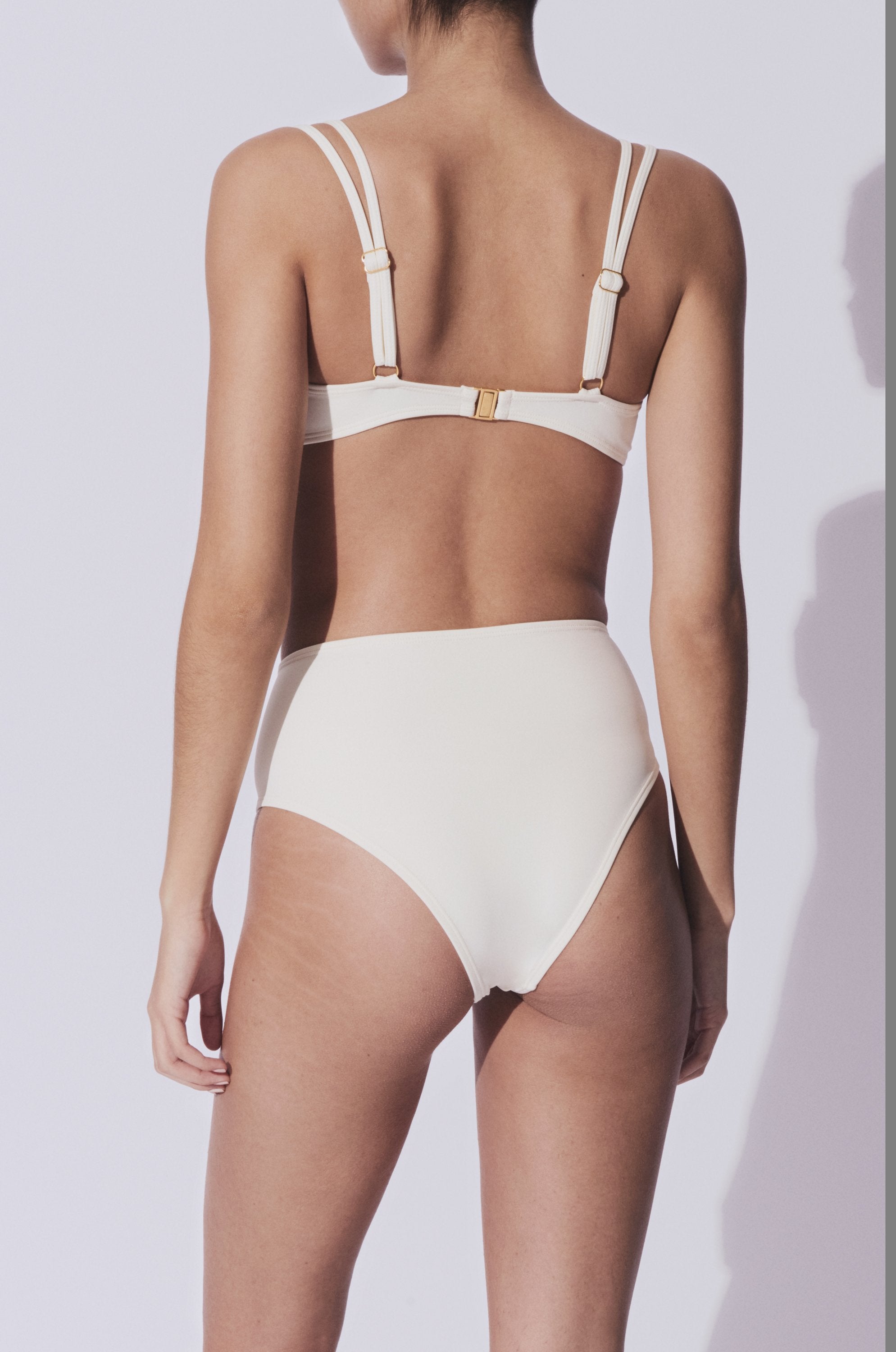 Wear our beautiful premium swimwear anywhere from the beach to the pool. They are made from high quality materials, in white color with gold hardware