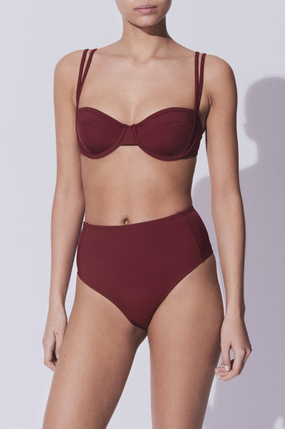 Our kumanomi burgundy sert is comprised by a high waist bottoms with good coverage and a cup top that is sexy and cheeky but not too revealing. We make premium swimwear, elegant bikinis and sustainable swimwear