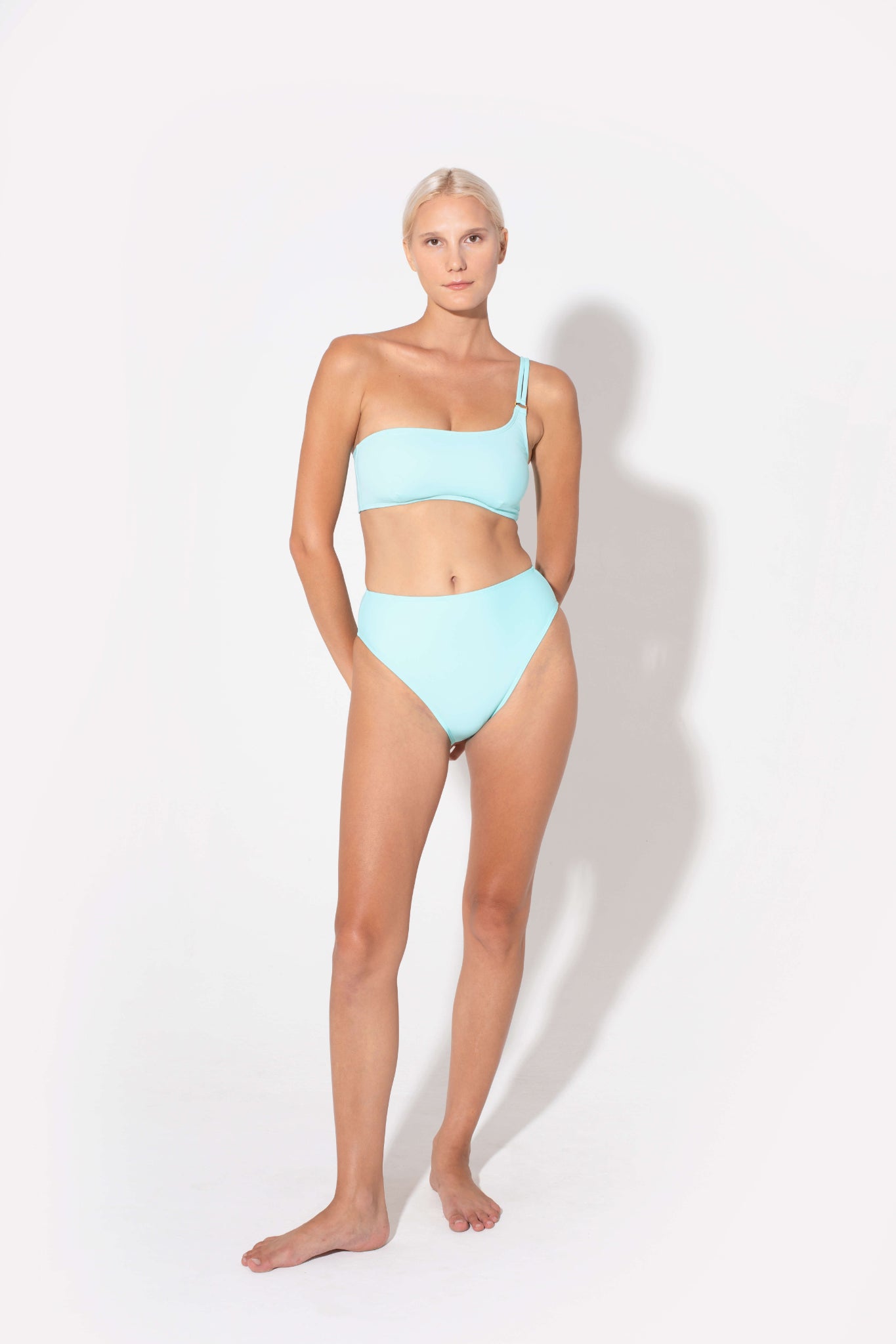 the swimwear brand that all influencers love is Koraru. swimwear for mothers that want to move around and feel comfortable. Blue bandeau bra