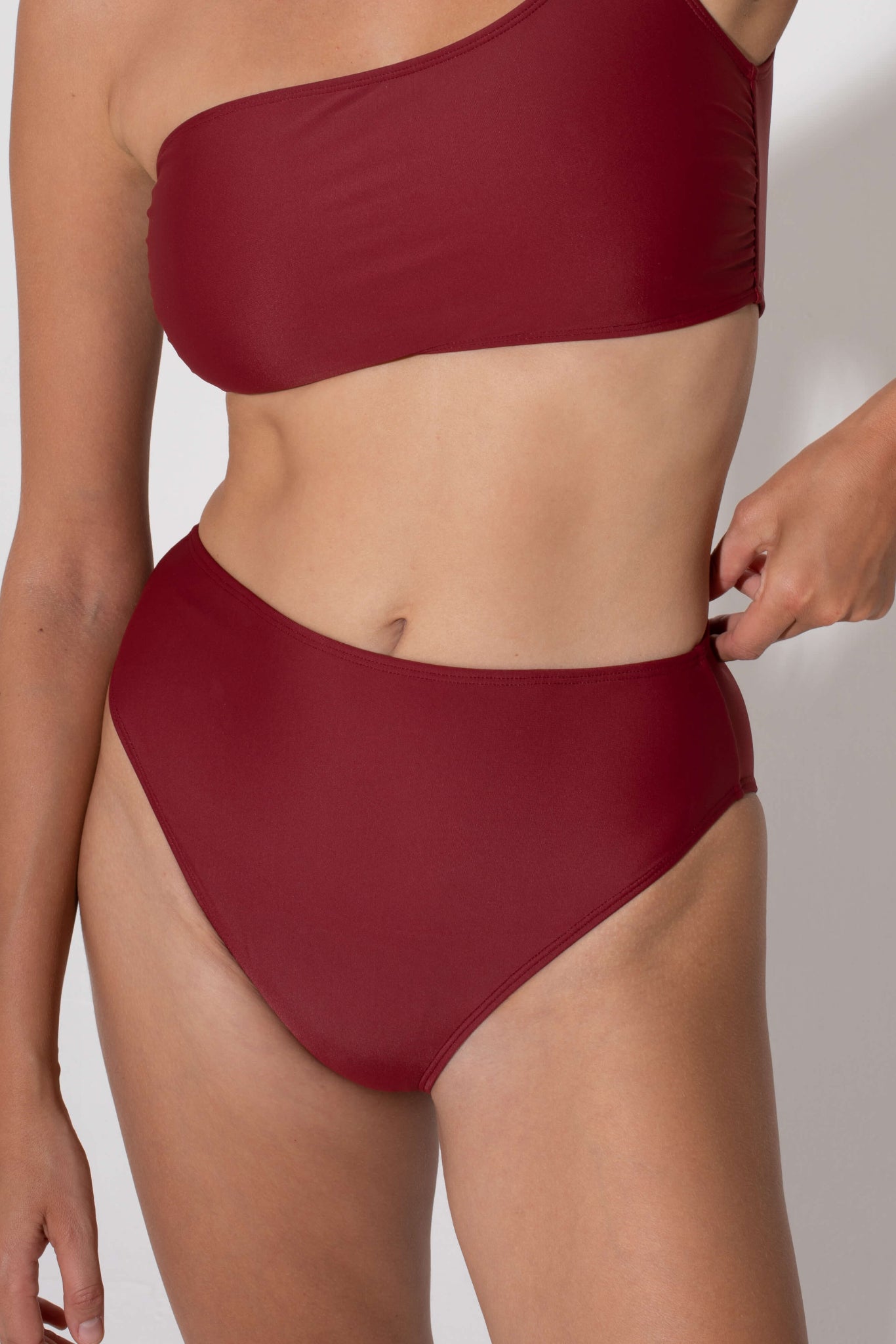 Comfortable swimwear briefs that are red and high waist made from soft and sustainable fabrics