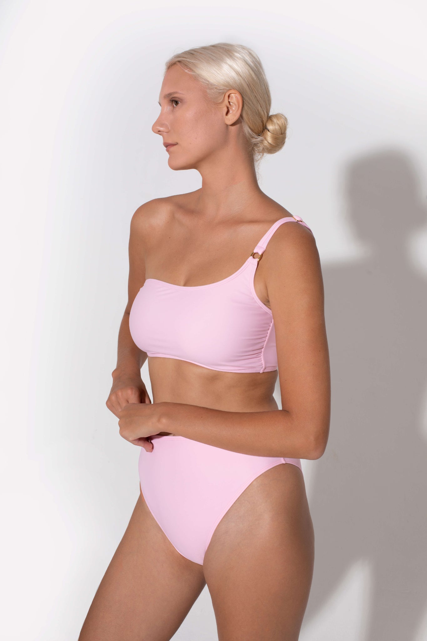 bandeau top that is comfortable and offers high support in pink color made from eco friendly fabrics that donates to the ocean for every piece sold, koraru is an ethical swimwear brand