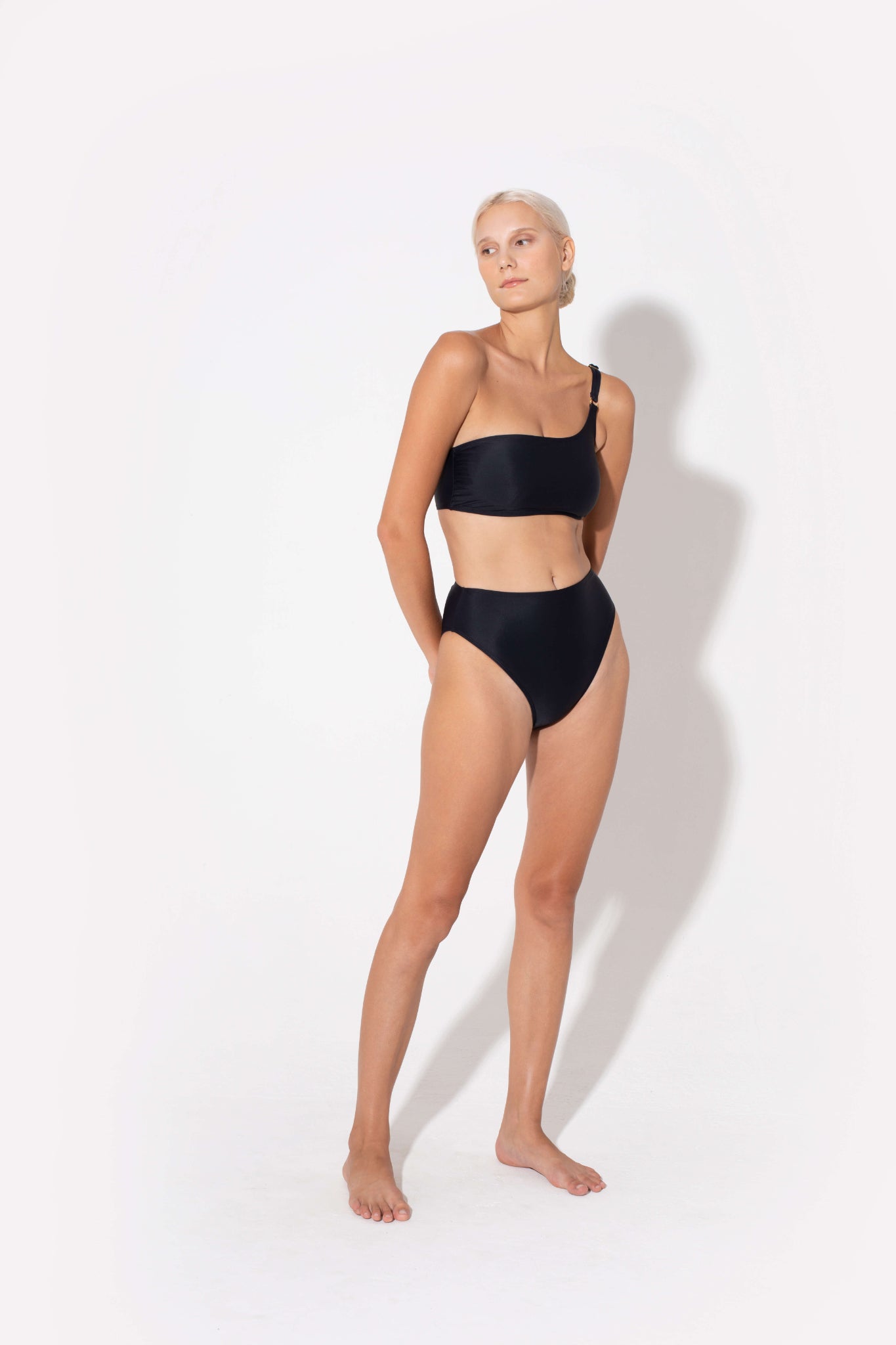 comfortable and sexy swimwear Koraru. Black bikini made from bandeau top and bottoms from shiny and soft fabrics