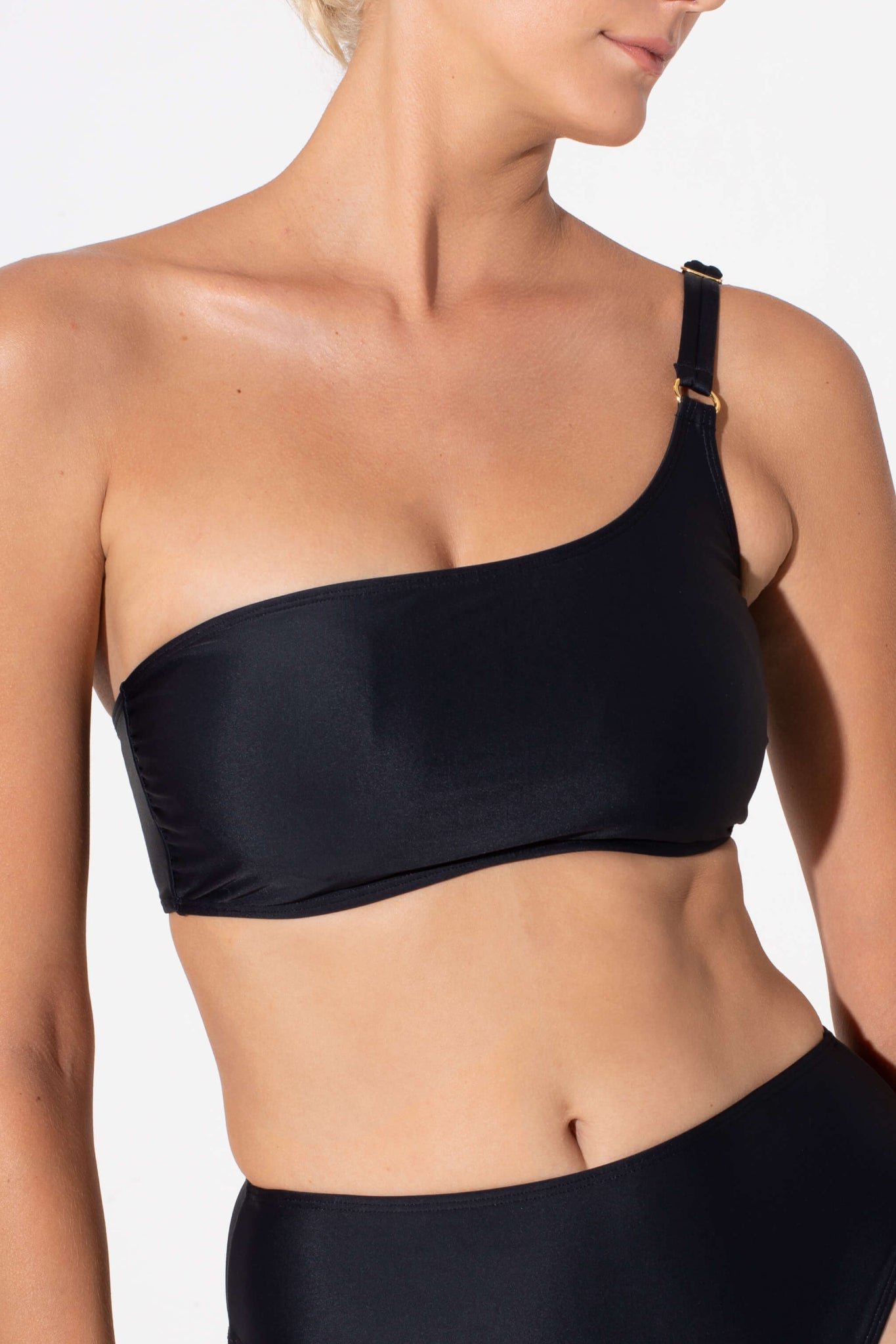 black bikini bra made from sustainable fabrics. Best swimsuit to wear on the beach to play sports