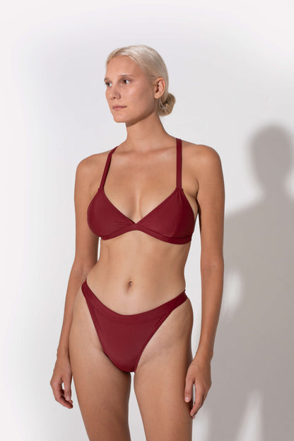 Hedy mid rise bikini bottoms in burgundy from luxury sustainable swimwear brand Koraru best bikini to tan in