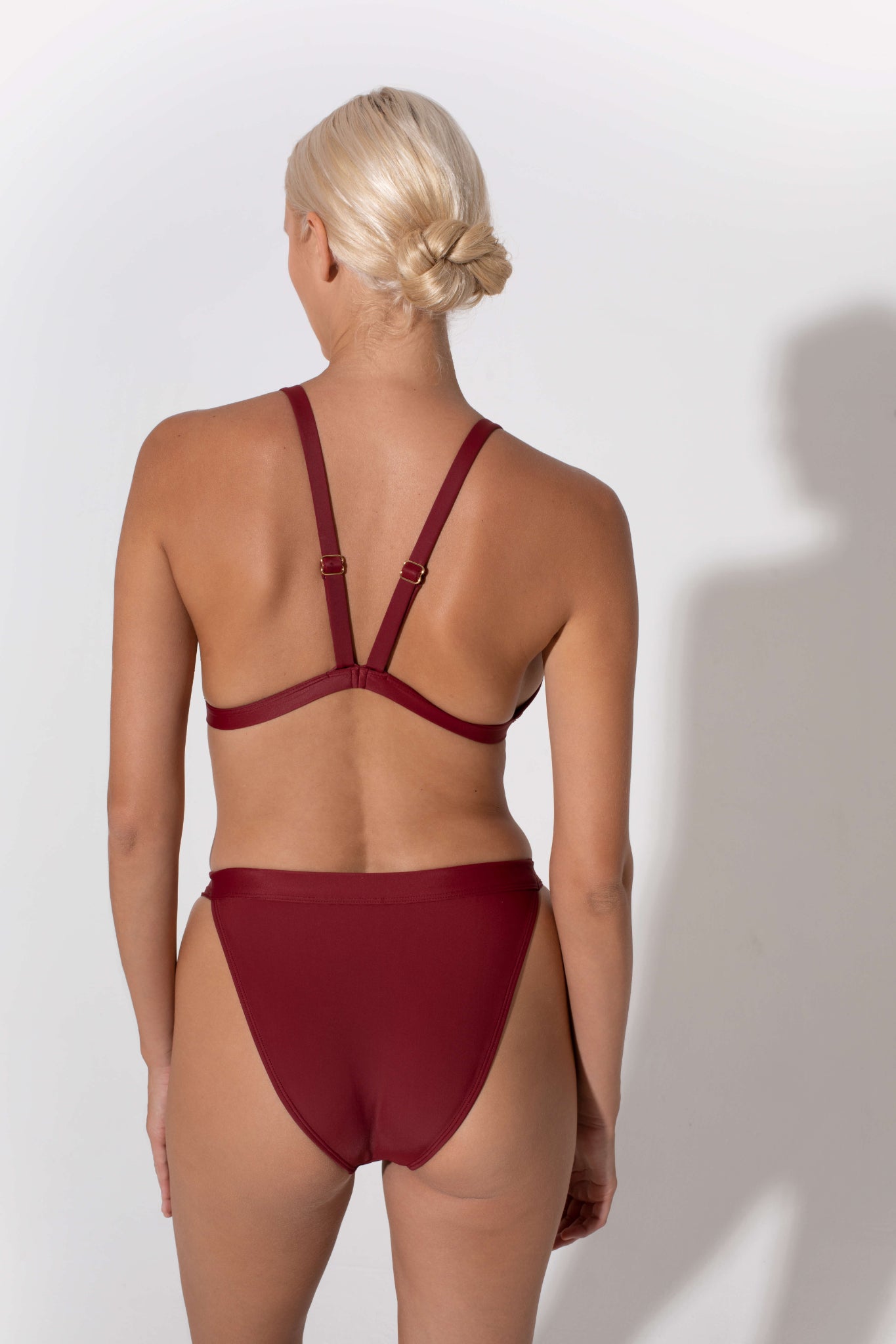Hedy triangle bikini top in burgundy from luxury sustainable swimwear brand Koraru regenerated nylon fabrics