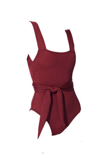 Chikyu belted one piece swimming suit in burgundy from luxury sustainable swimwear brand Koraru